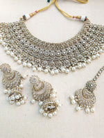 Load image into Gallery viewer, Antique Gold necklace set with chandbali earrings and tikka. Polki choker necklace set. Indian wedding jewelry. Pakistani wedding jewelry. Bollywood necklace set. Punjabi jewelry set. Kundan necklace jhumka. Antique gold-plated necklace. Champagne stones.
