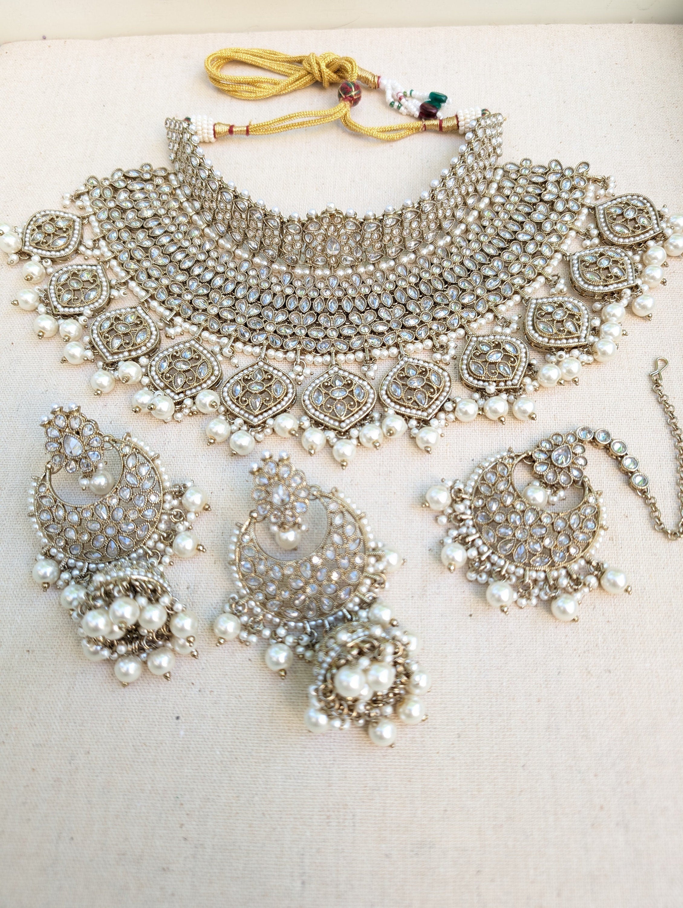 Antique Gold necklace set with chandbali earrings and tikka. Polki choker necklace set. Indian wedding jewelry. Pakistani wedding jewelry. Bollywood necklace set. Punjabi jewelry set. Kundan necklace jhumka. Antique gold-plated necklace. Champagne stones.