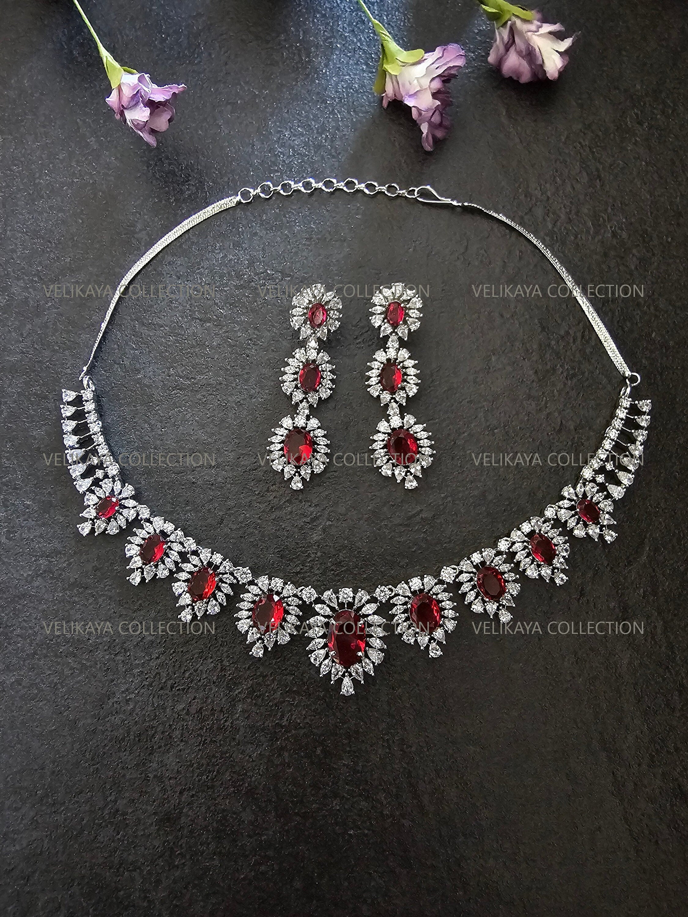 CZ Diamond Necklace Set. Silver Statement Necklace. Indian Wedding Jewelry. Pakistani Wedding Jewelry. Bollywood Jewelry. American Diamond Earrings. Statement CZ earrings. Cubic Zirconia Bridal necklace set. American diamond wedding necklace. The best Indian and Pakistani online jewelry store near you.