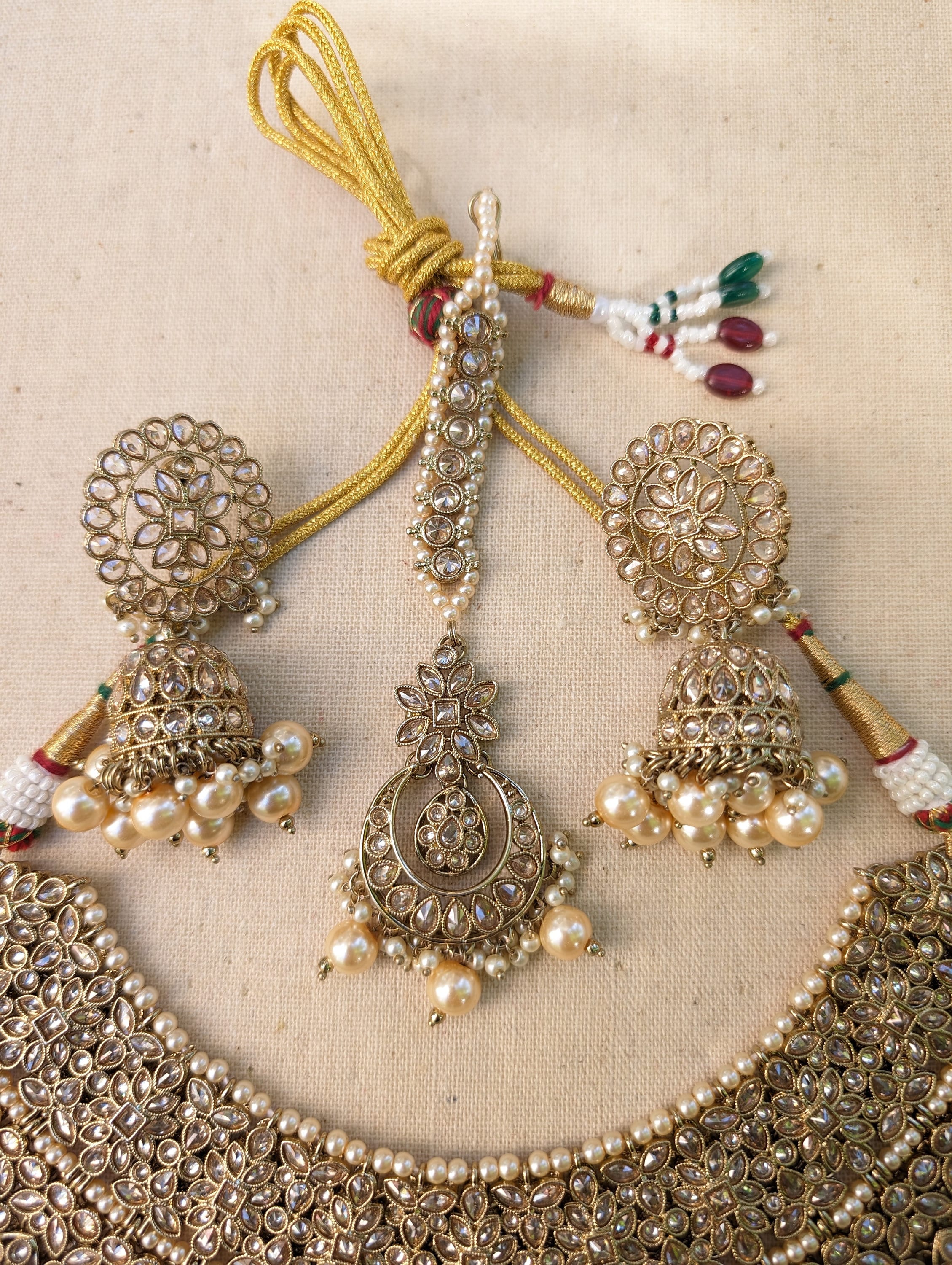 Gold necklace set with chandbali earrings and tikka. Polki choker necklace set. Indian wedding jewelry. Pakistani wedding jewelry. Bollywood necklace set. Punjabi jewelry set. Kundan necklace jhumka. Antique gold-plated necklace. Champagne stones.