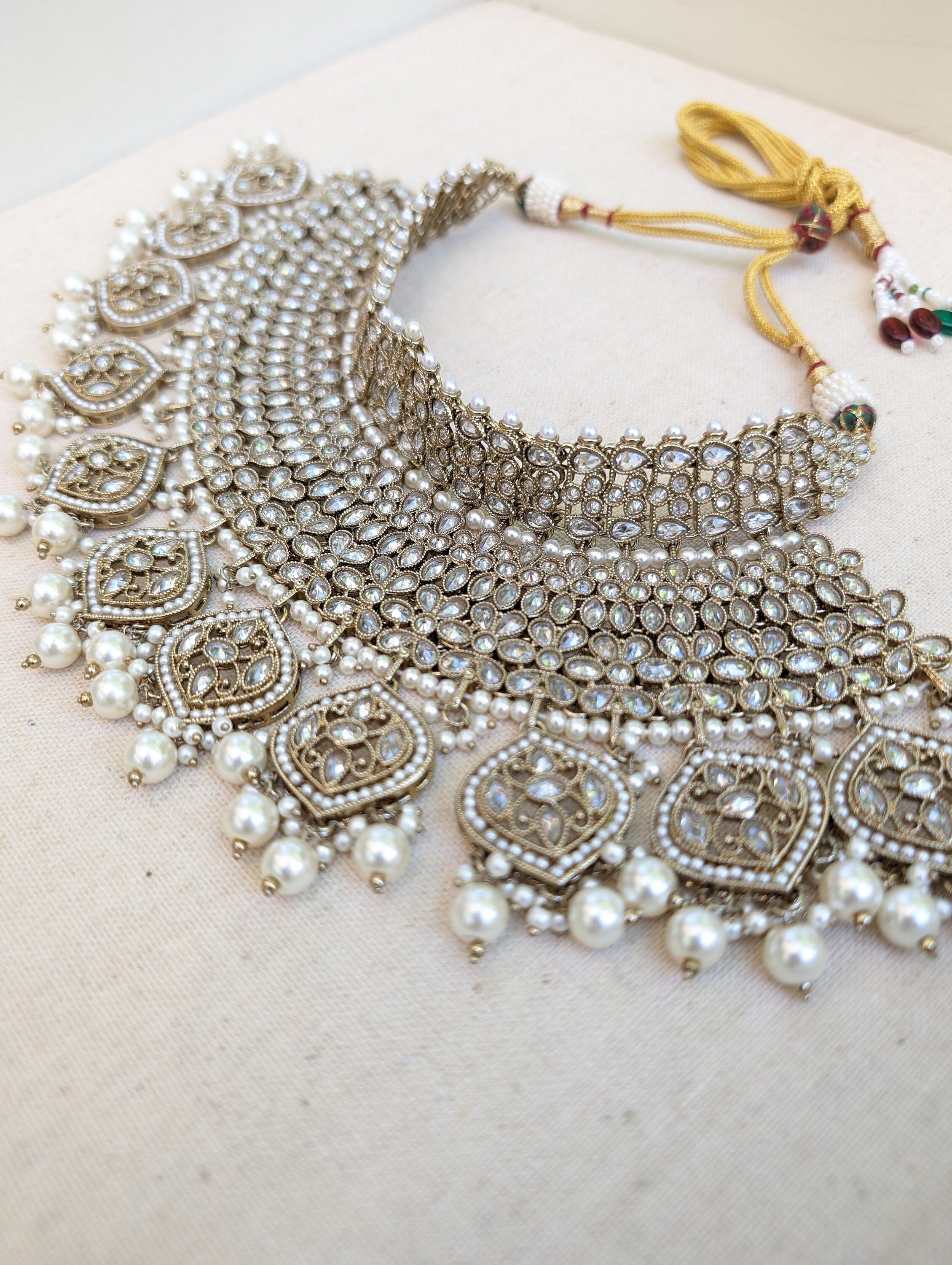 Antique Gold necklace set with chandbali earrings and tikka. Polki choker necklace set. Indian wedding jewelry. Pakistani wedding jewelry. Bollywood necklace set. Punjabi jewelry set. Kundan necklace jhumka. Antique gold-plated necklace. Champagne stones.