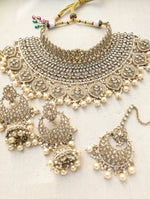 Load image into Gallery viewer, Gold necklace set with chandbali earrings and tikka. Polki choker necklace set. Indian wedding jewelry. Pakistani wedding jewelry. Bollywood necklace set. Punjabi jewelry set. Kundan necklace jhumka. Antique gold-plated necklace. Champagne stones.
