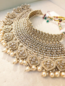 Gold necklace set with chandbali earrings and tikka. Polki choker necklace set. Indian wedding jewelry. Pakistani wedding jewelry. Bollywood necklace set. Punjabi jewelry set. Kundan necklace jhumka. Antique gold-plated necklace. Champagne stones.