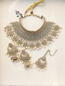 Gold necklace set with chandbali earrings and tikka. Polki choker necklace set. Indian wedding jewelry. Pakistani wedding jewelry. Bollywood necklace set. Punjabi jewelry set. Kundan necklace jhumka. Antique gold-plated necklace. Champagne stones.