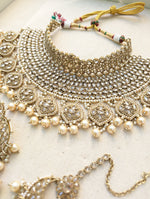 Load image into Gallery viewer, Gold necklace set with chandbali earrings and tikka. Polki choker necklace set. Indian wedding jewelry. Pakistani wedding jewelry. Bollywood necklace set. Punjabi jewelry set. Kundan necklace jhumka. Antique gold-plated necklace. Champagne stones.
