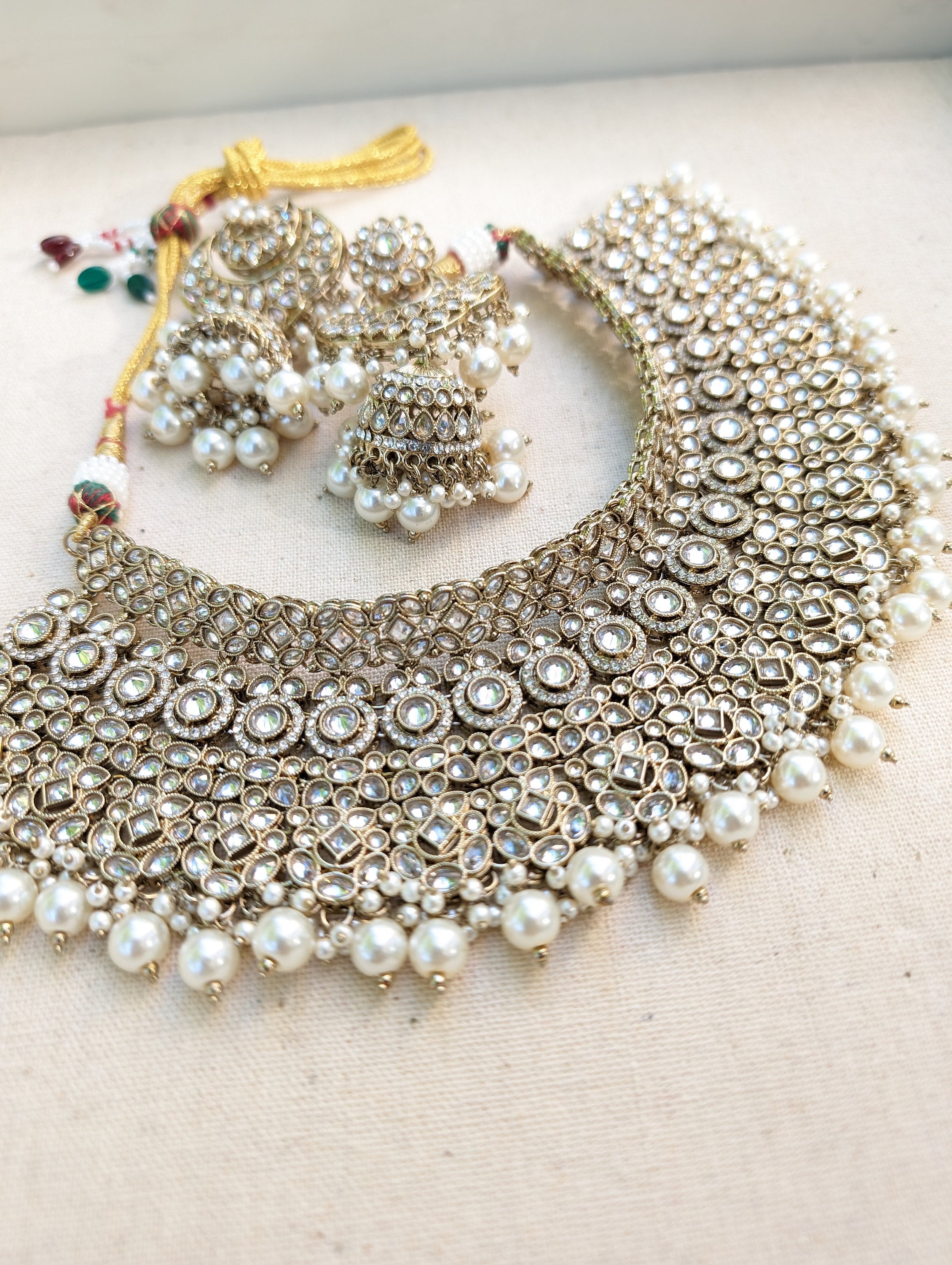 Antique Gold necklace set with chandbali earrings and tikka. Polki choker necklace set. Indian wedding jewelry. Pakistani wedding jewelry. Bollywood necklace set. Punjabi jewelry set. Kundan necklace jhumka. Antique gold-plated necklace. Champagne stones.