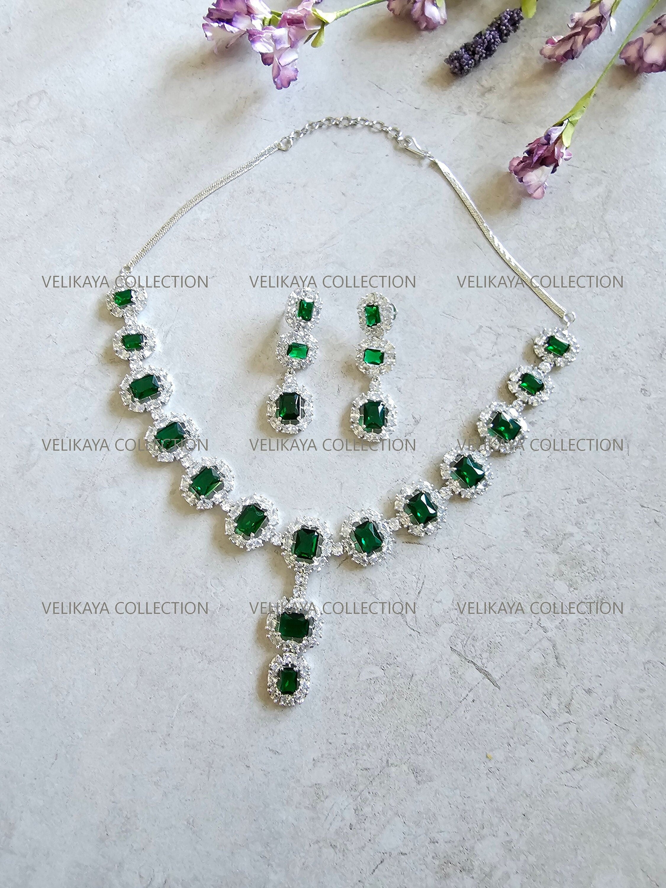 CZ Diamond Necklace Set. Silver Statement Necklace. Indian Wedding Jewelry. Pakistani Wedding Jewelry. Bollywood Jewelry. American Diamond Earrings. Statement CZ earrings. Cubic Zirconia Bridal necklace set. American diamond wedding necklace. The best Indian and Pakistani online jewelry store near you.