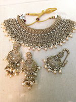 Load image into Gallery viewer, Gold necklace set with chandbali earrings and tikka. Polki choker necklace set. Indian wedding jewelry. Pakistani wedding jewelry. Bollywood necklace set. Punjabi jewelry set. Kundan necklace jhumka. Antique gold-plated necklace. Champagne stones.
