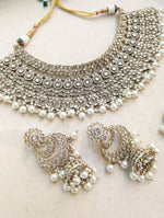 Load image into Gallery viewer, Antique Gold necklace set with chandbali earrings and tikka. Polki choker necklace set. Indian wedding jewelry. Pakistani wedding jewelry. Bollywood necklace set. Punjabi jewelry set. Kundan necklace jhumka. Antique gold-plated necklace. Champagne stones.
