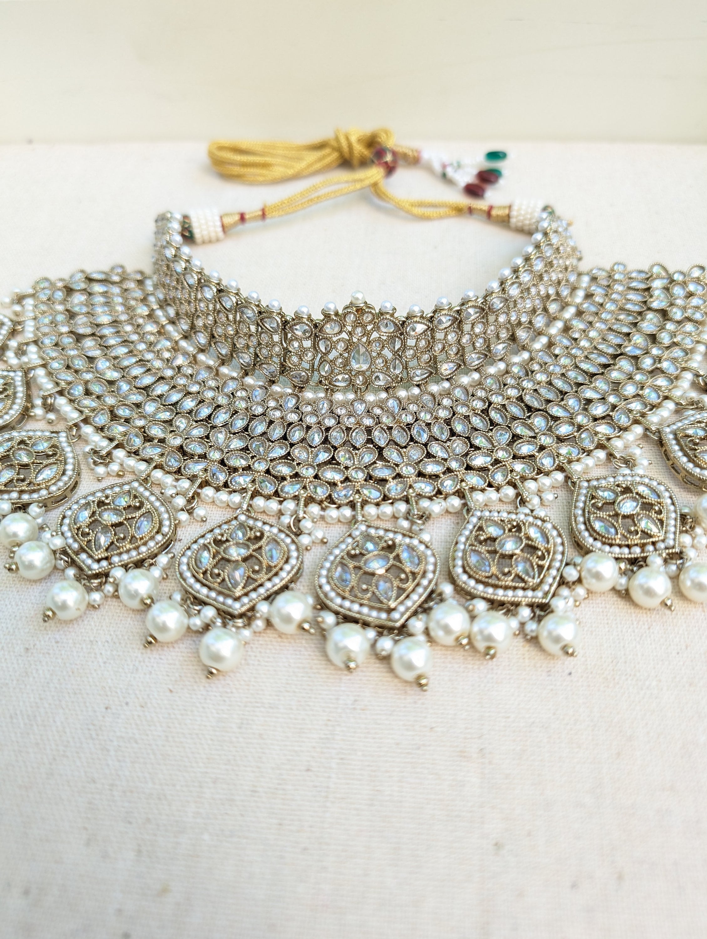 Antique Gold necklace set with chandbali earrings and tikka. Polki choker necklace set. Indian wedding jewelry. Pakistani wedding jewelry. Bollywood necklace set. Punjabi jewelry set. Kundan necklace jhumka. Antique gold-plated necklace. Champagne stones.