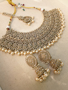 Gold necklace set with chandbali earrings and tikka. Polki choker necklace set. Indian wedding jewelry. Pakistani wedding jewelry. Bollywood necklace set. Punjabi jewelry set. Kundan necklace jhumka. Antique gold-plated necklace. Champagne stones.