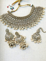 Load image into Gallery viewer, Gold necklace set with chandbali earrings and tikka. Polki choker necklace set. Indian wedding jewelry. Pakistani wedding jewelry. Bollywood necklace set. Punjabi jewelry set. Kundan necklace jhumka. Antique gold-plated necklace. Champagne stones.
