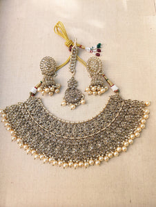 Gold necklace set with chandbali earrings and tikka. Polki choker necklace set. Indian wedding jewelry. Pakistani wedding jewelry. Bollywood necklace set. Punjabi jewelry set. Kundan necklace jhumka. Antique gold-plated necklace. Champagne stones.