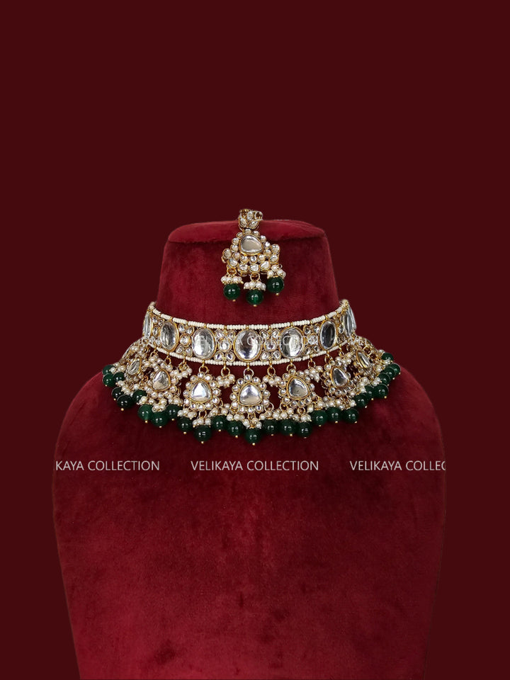 indian kundan necklace set with green beads, earrings and tikka for indian and pakistani weddings.
