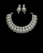 Load image into Gallery viewer, This is silver plated american diamond necklace with statement earrings for weddings and parties.
