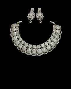 This is silver plated american diamond necklace with statement earrings for weddings and parties.